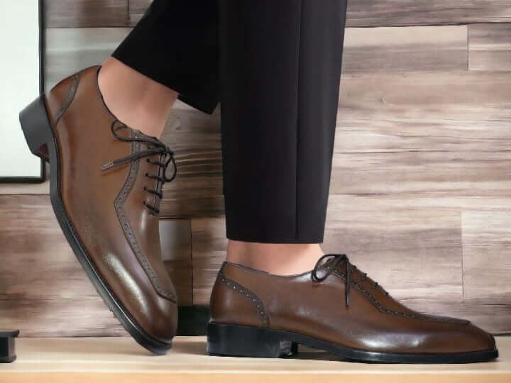 Expertly crafted, these men's brown oxfords shoes are the perfect combination of luxury and functionality. Handmade with premium materials, they exude sophistication and are perfect for the office or any formal occasion. Elevate your style with these high-quality shoes that will make a lasting impression.