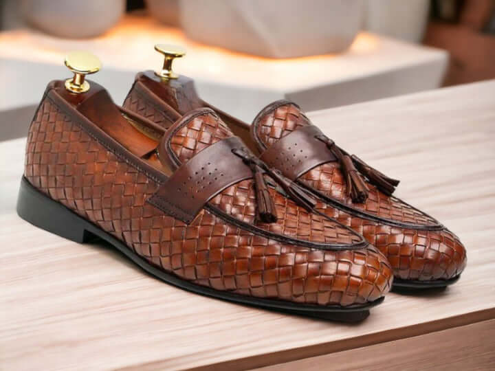 Discover the perfect blend of style and craftsmanship with our Handmade Men's Woven Leather Loafers. These unique slip-ons feature a stylish woven design in luxurious brown leather. Step up your shoe game with this one-of-a-kind footwear for men. Expertly handmade for true quality and sophistication.