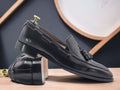 Expertly crafted in soft leather, these handmade black loafer tussle slip-on moccasin shoes provide both style and comfort for men. The tussle detailing adds a touch of sophistication, making them the perfect choice for any occasion. Look fashionable and feel confident in these high-quality leather shoes.