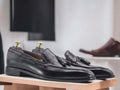 Expertly crafted in soft leather, these handmade black loafer tussle slip-on moccasin shoes provide both style and comfort for men. The tussle detailing adds a touch of sophistication, making them the perfect choice for any occasion. Look fashionable and feel confident in these high-quality leather shoes.