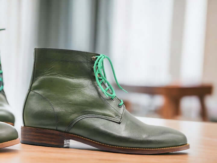 Expertly crafted from 100% genuine leather, these ankle high green boots are handmade for superior quality Chukka boots. Durable and stylish, these boots are perfect for any occasion. Pair them with any outfit for a timeless look.