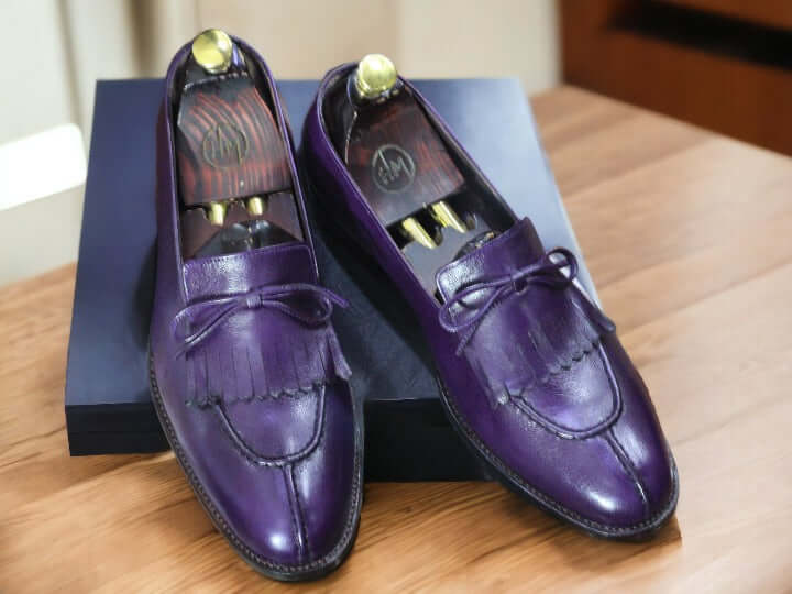 Experience the ultimate comfort and style with our Handmade Purple Cow Hide Genuine Leather Shoes. Made with high-quality leather and expertly crafted by hand, these Men's Fringe Loafer Shoes offer a sophisticated look and unparalleled durability. Elevate your shoe game with these unique and timeless shoes