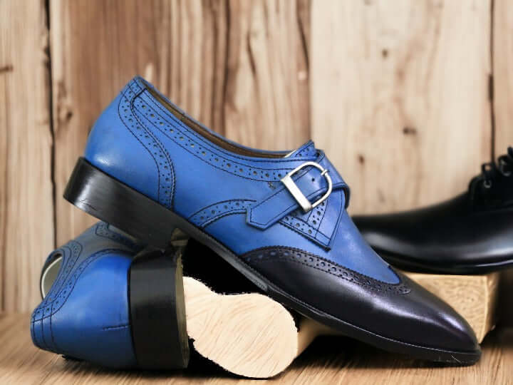 Expertly crafted by hand, these Men's Blue Monk Dress Leather Buckle Shoes are the epitome of luxury and style. Made with the finest quality leather, these shoes offer comfort, durability, and a classic look. The unique monk strap design adds a touch of sophistication, making them the perfect choice for any formal occasion.