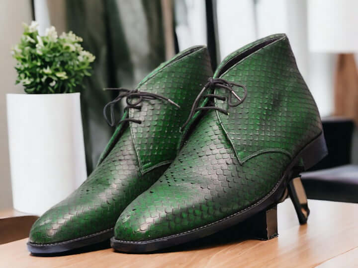 Expertly crafted with sleek black python leather, these handmade chukka boots are a sophisticated addition to any man's wardrobe. The exotic leather not only adds a touch of luxury, but also provides durability for long-lasting wear. Elevate your style with these unique and timeless boots.