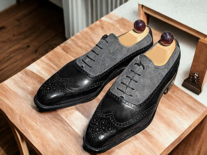 Expertly crafted with genuine leather and suede, these handmade dress shoes offer a timeless and sophisticated look for any occasion. The high-quality materials ensure durability and comfort while the sleek black and grey color combination adds a touch of modern elegance. Elevate your style with these premium dress shoes.