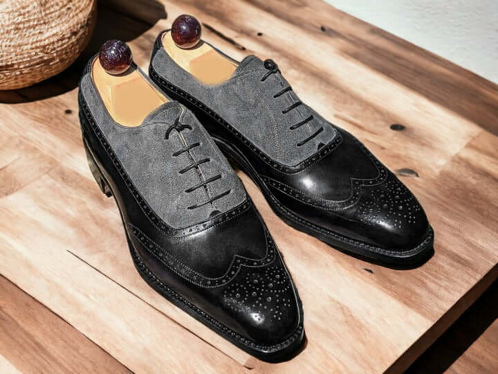 Expertly crafted with genuine leather and suede, these handmade dress shoes offer a timeless and sophisticated look for any occasion. The high-quality materials ensure durability and comfort while the sleek black and grey color combination adds a touch of modern elegance. Elevate your style with these premium dress shoes.