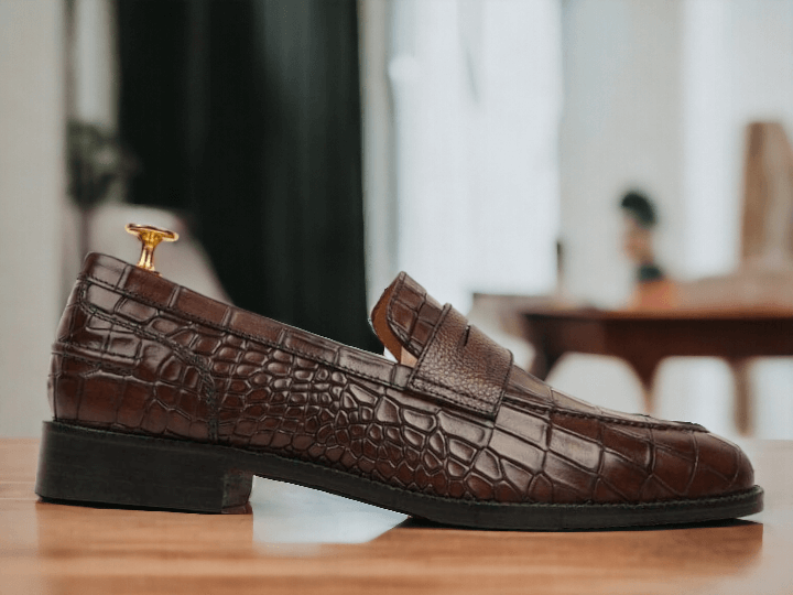 Expertly crafted from luxurious alligator leather, these Men Brown Loafer Penny Shoes exude sophistication and style. Each pair is meticulously handmade for a perfect fit and superior comfort. Elevate your wardrobe with these timeless and elegant loafers.