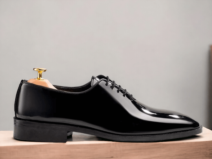 Classic Whole cut Oxford Italian dress shoes in black patent leather. A perfect complement to a Tuxedo, the whole cut Oxfords in black patent is the perfect Dress Shoes 