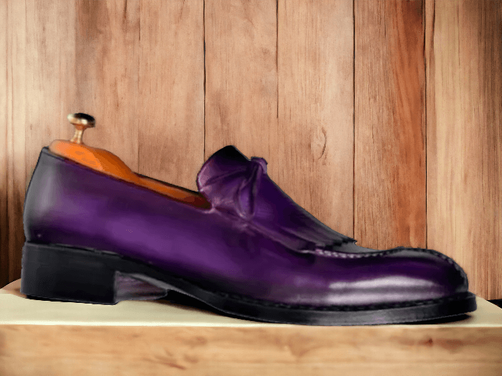 These Men's Purple Split Toe Loafer Shoes are both stylish and sophisticated. Handmade from high-quality leather, these formal shoes are the perfect addition to any wardrobe. With a unique split toe design, these shoes offer a modern twist on a classic loafer style. Elevate your look with these expertly crafted shoes.