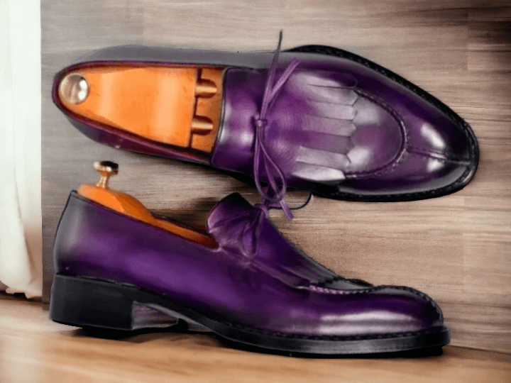 These Men's Purple Split Toe Loafer Shoes are both stylish and sophisticated. Handmade from high-quality leather, these formal shoes are the perfect addition to any wardrobe. With a unique split toe design, these shoes offer a modern twist on a classic loafer style. Elevate your look with these expertly crafted shoes.