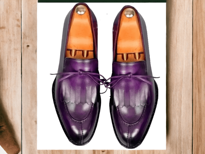 These Men's Purple Split Toe Loafer Shoes are both stylish and sophisticated. Handmade from high-quality leather, these formal shoes are the perfect addition to any wardrobe. With a unique split toe design, these shoes offer a modern twist on a classic loafer style. Elevate your look with these expertly crafted shoes.