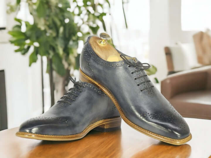 Enjoy the timeless style of these Handmade Grey Leather Shoes. Crafted with a Whole Cut Lace Up design and premium leather, they are perfect for dressing up or down. Perfectly polished, these dress shoes will ensure you look your best.