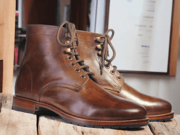 Expertly handcrafted, these Ankle High Brown Lace Up Leather Boots are a stylish addition to any wardrobe. The side lace-up design offers both fashion and function, ensuring a perfect fit every time. Made from high-quality leather, these boots are perfect for any occasion and are sure to elevate your style.