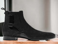 Introducing our Bespoke Buckle Chelsea Boots, featuring handmade suede and a stylish buckle design. These dress formal slip on boots are perfect for any occasion, providing both style and comfort. Step up your footwear game with our ankle-high boots for men.