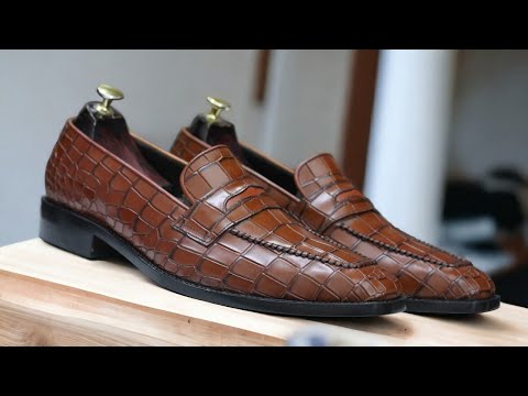 Expertly crafted for the discerning gentleman, our Handmade Alligator Print Penny Loafer Shoes are the perfect combination of style and comfort. Made with genuine tan alligator print leather, these slip on loafers exude sophistication and quality. Elevate your wardrobe with these luxurious handmade shoes.